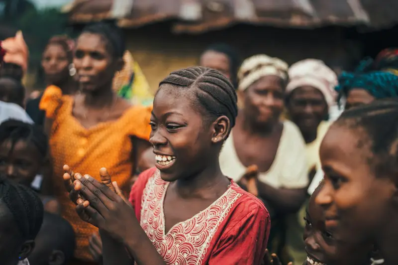A crowd of people at a community gathering in Africa